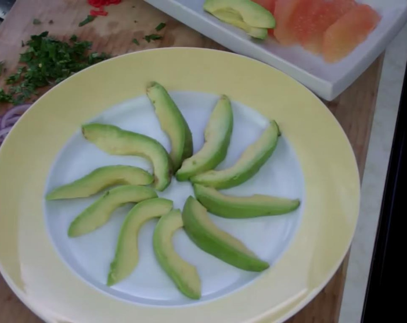 step 1 Thinly slice the Avocados (2) and lay them on the plate in a flared out design on the plate.