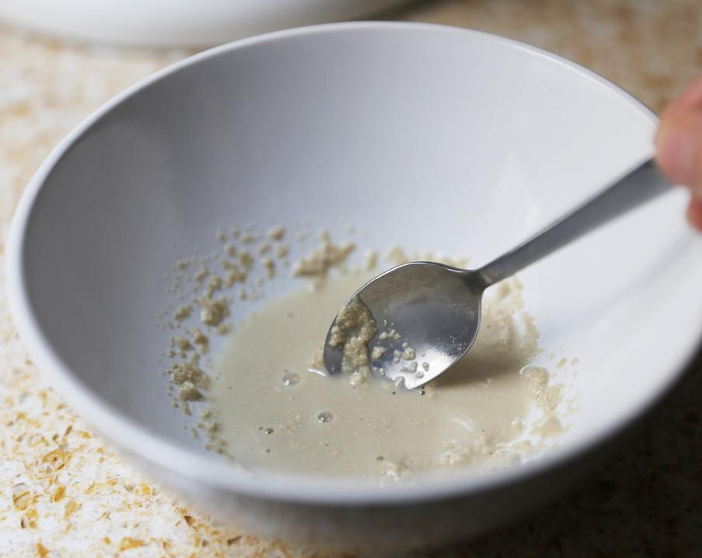 step 2 Dissolve the Instant Dry Yeast (1 tsp), Caster Sugar (1 pinch) and Water (1 Tbsp) in a bowl.