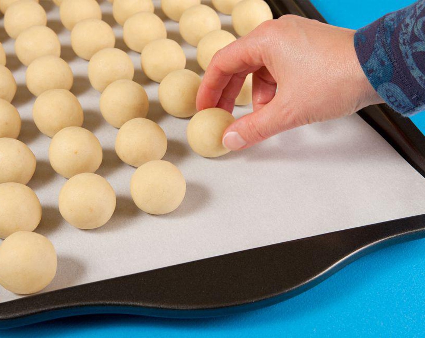 step 6 Place the cake balls in a cookie sheet lined with parchment paper. Cover the balls with a plastic wrap and foil. Put this in the refrigerator for a minimum of four hours.