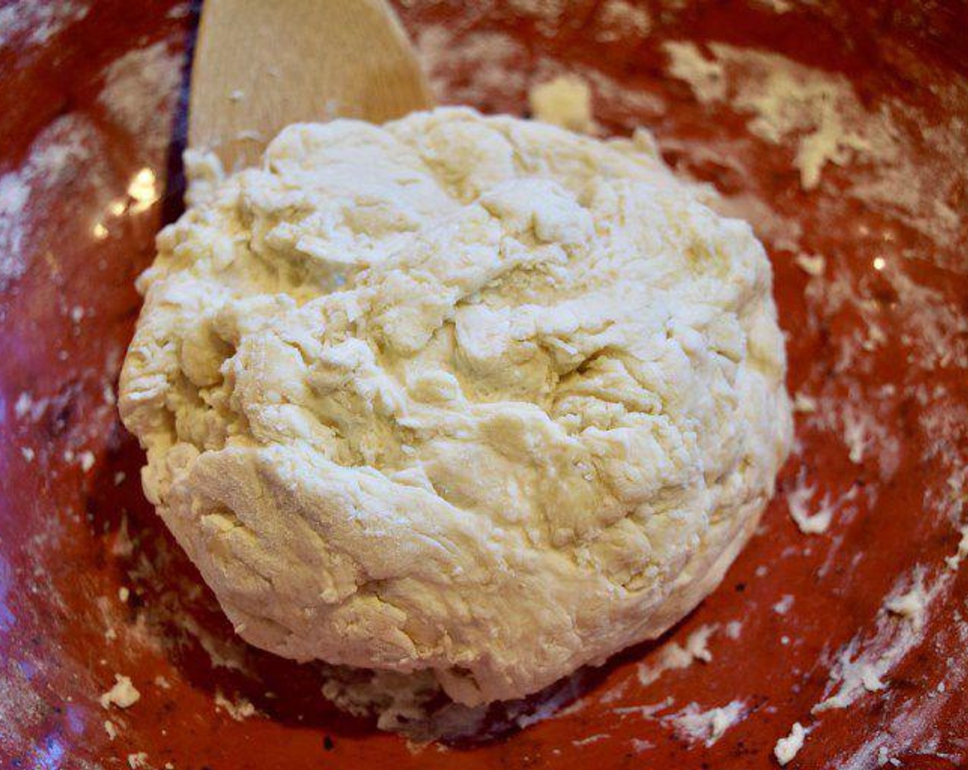 step 3 With a wooden spoon, stir the ingredients together until evenly combined and until it pulls into a cohesive ball.