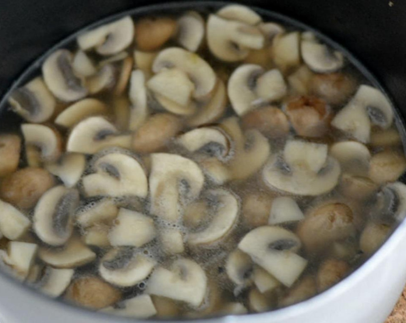 step 3 Add Chicken Stock (2 cups), Bay Leaf (1), Fresh Rosemary (to taste), Salt (to taste), and Ground Black Pepper (to taste) to the pot and simmer over medium-high heat for 10 minutes.