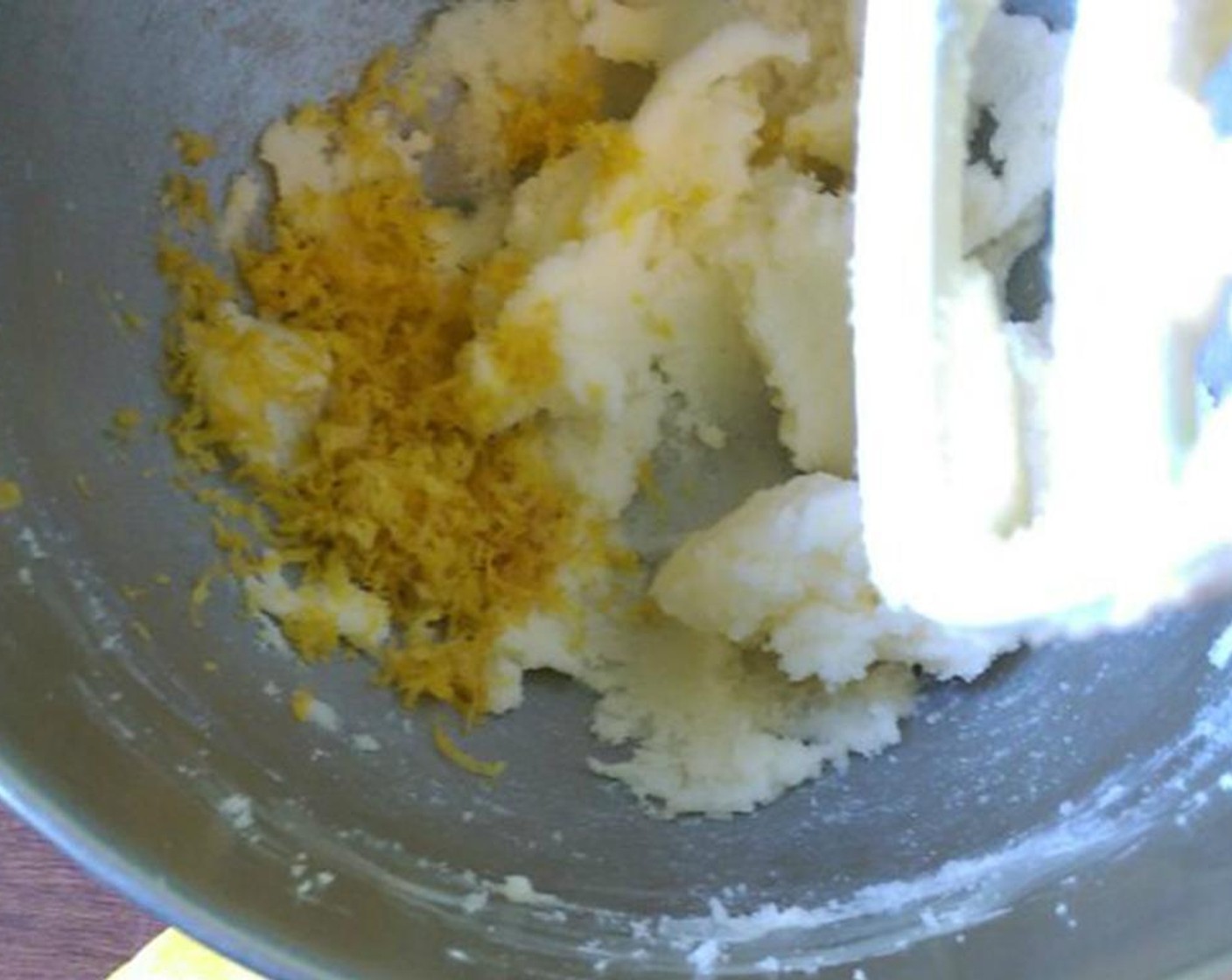 step 3 In the bowl of a stand mixer, combine Unsalted Butter (1/2 cup), Granulated Sugar (1 cup) and zest from Lemons (3).