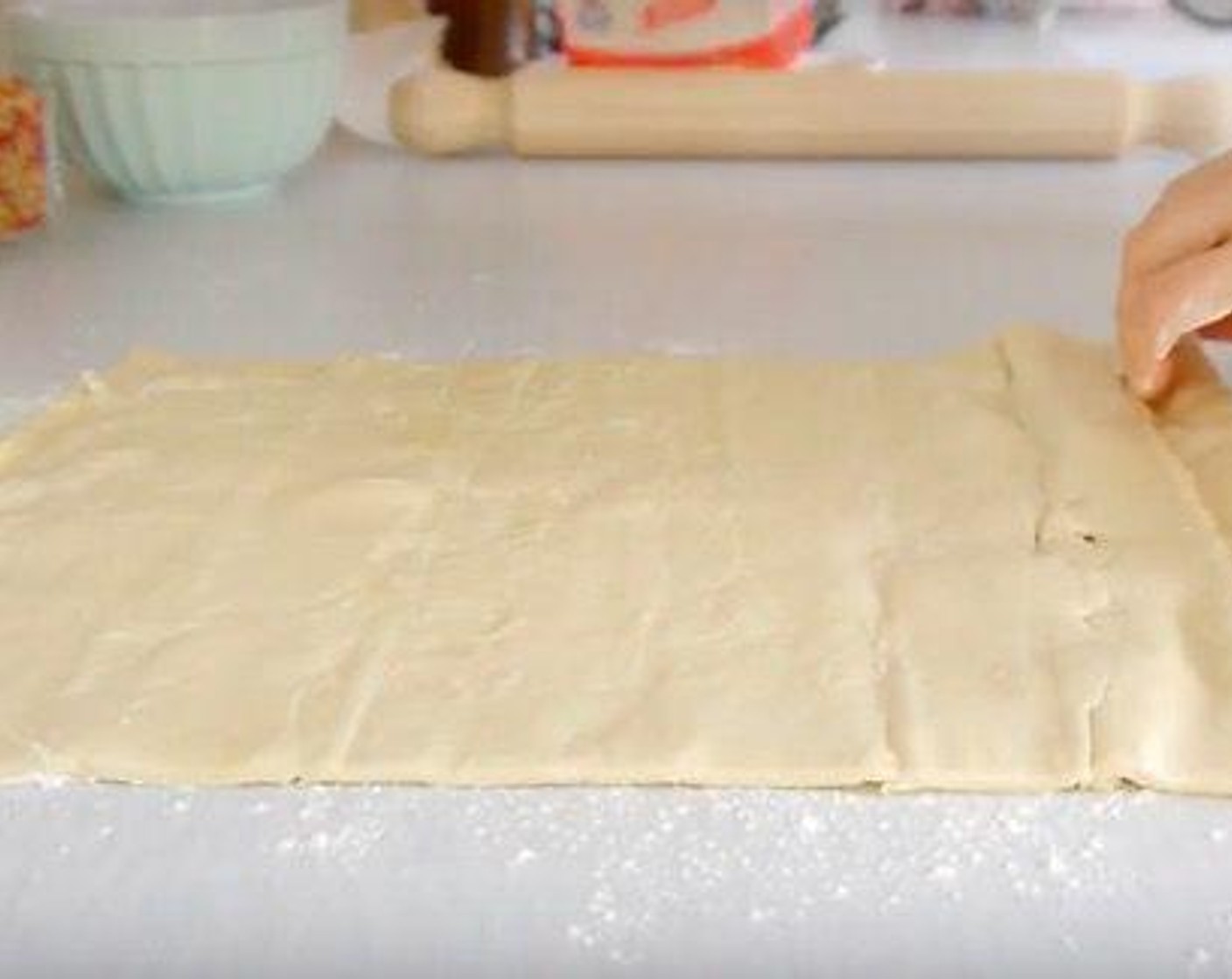 step 2 The first thing is to make the tart bases and cutting the Pastry Dough (13 oz) into squares to fit inside each of the tart molds.