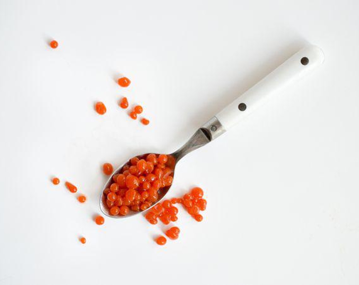 step 6 Place strained caviar into bowl of Water (1 cup) to remove remaining oil, then strain from water. Set aside.