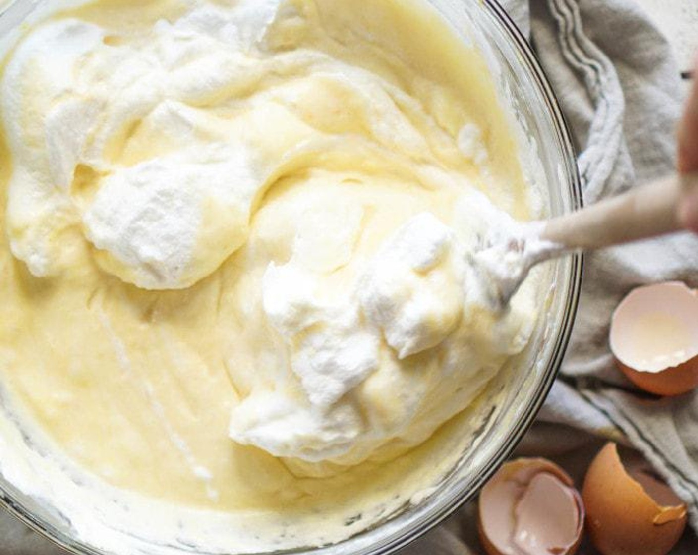 step 4 In a separate bowl mix the zest and juice from Oranges (2), Water (4 Tbsp), Vegetable Oil (1/2 cup), Vanilla Extract (1 Tbsp) and Eggland's Best Classic Eggs (6) Yolks. Pour into the "well" and whisk until no longer lumpy and smooth.