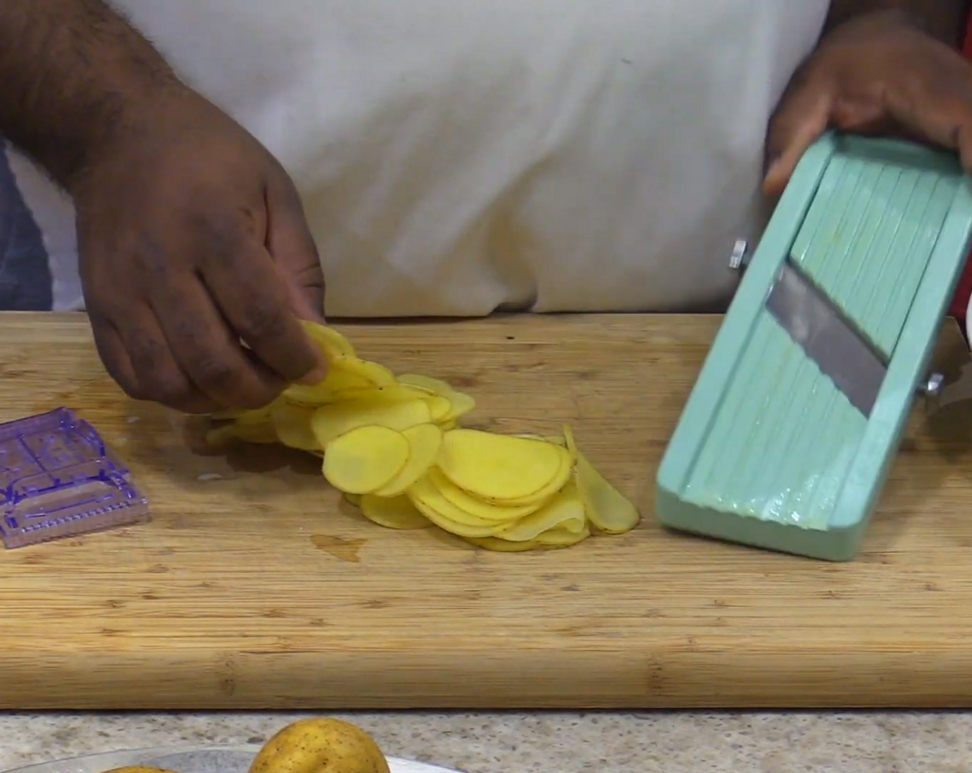 step 2 Using a mandoline, thinly slice the Yukon Gold Potatoes (3).