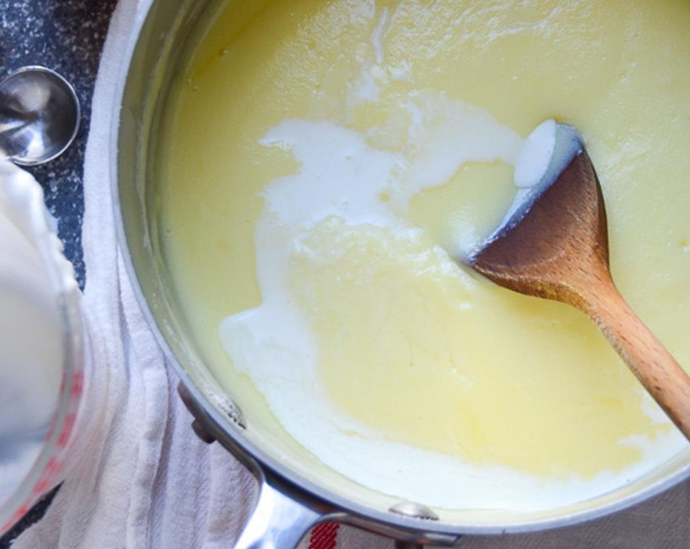 step 6 Pour the egg mixture back into the saucepan and heat over medium heat, stirring constantly until mixture thickens.