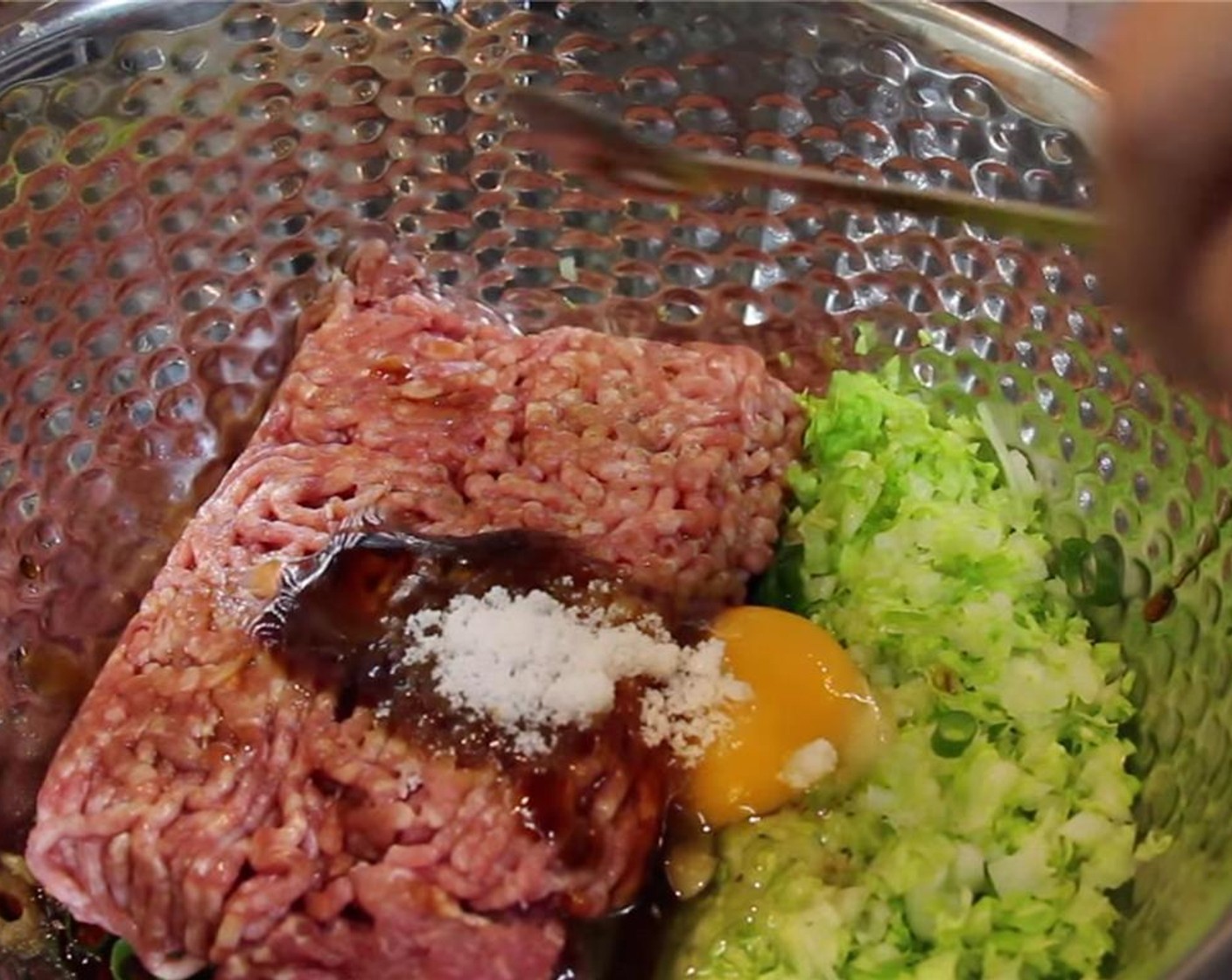 step 5 Add Ground Pork (13 oz) to the bowl along with Ground White Pepper (1/8 tsp), Soy Sauce (1/4 cup), Egg (1), Oyster Sauce (1 1/2 Tbsp), Sake (1 Tbsp), Granulated Sugar (1/2 Tbsp), and Sesame Oil (1 tsp).