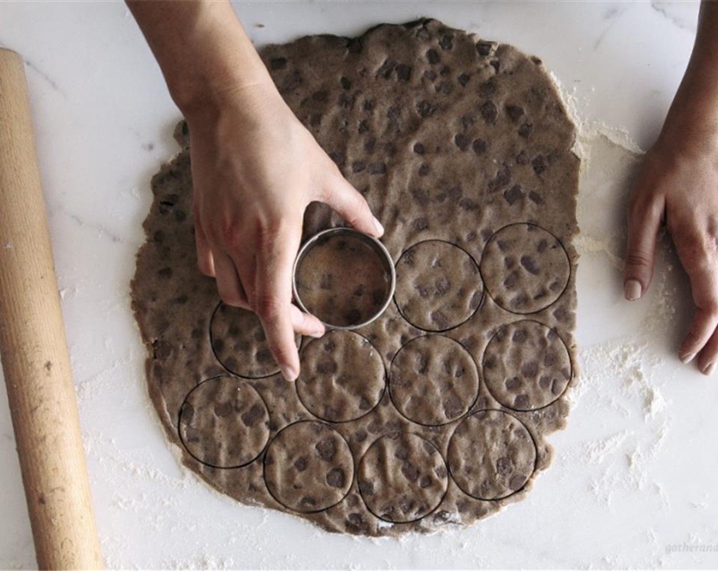 step 6 Using a rolling pin, roll the dough out until it’s about 1-centimeter thick, then cut the dough into 6-centimeter rounds using a cookie cutter.