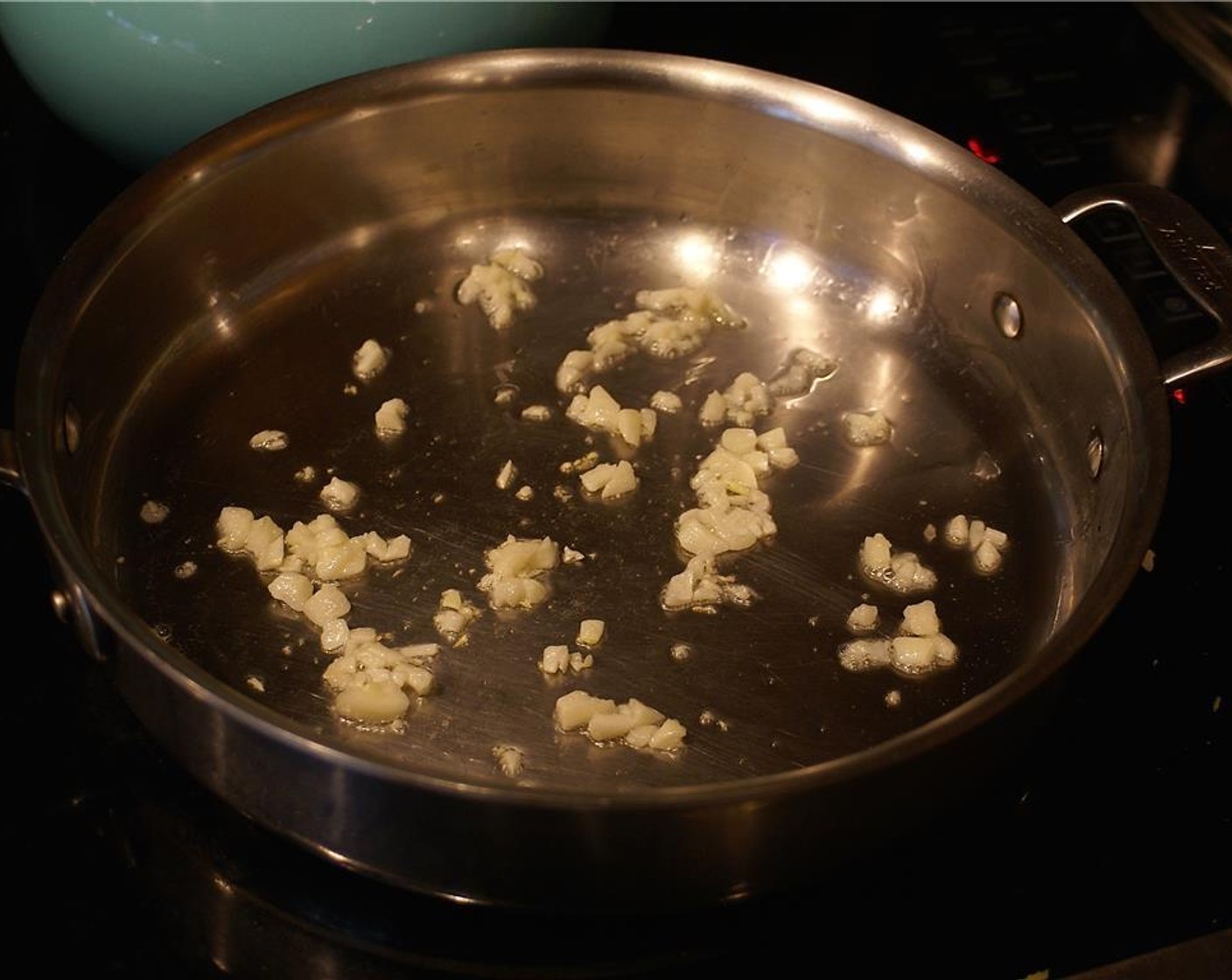 step 4 Heat Coconut Oil (1 Tbsp) in a pan over medium heat.  Add the Garlic (3 cloves) and sauté until it is fragrant, about 30 seconds.