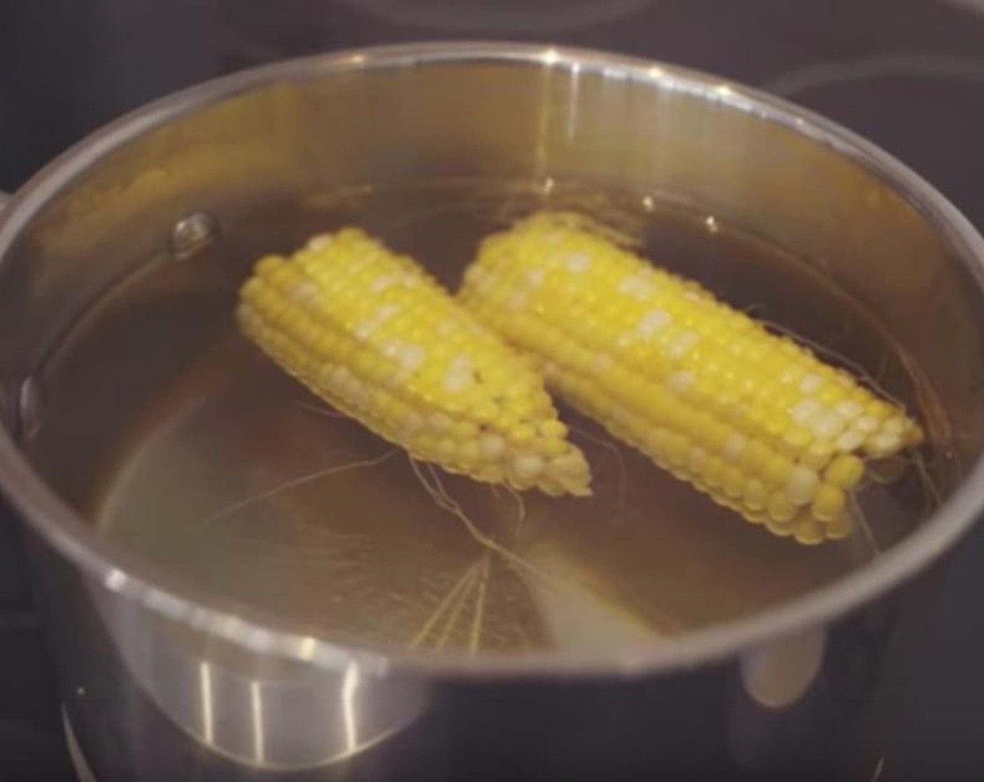 step 2 Boil Corn Cobs (2) for a couple of minutes or until ready, and cut the kernels off the corn.