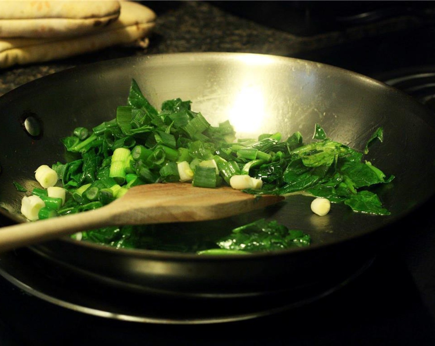 step 5 Heat a 10-inch oven-safe frying pan over medium heat. Add Butter (1 Tbsp) and tilt the pan until butter coats the bottom. Cook spinach for 2-3 minutes until it has wilted and collapsed in size. Add scallions and cook for 2-3 more minutes.