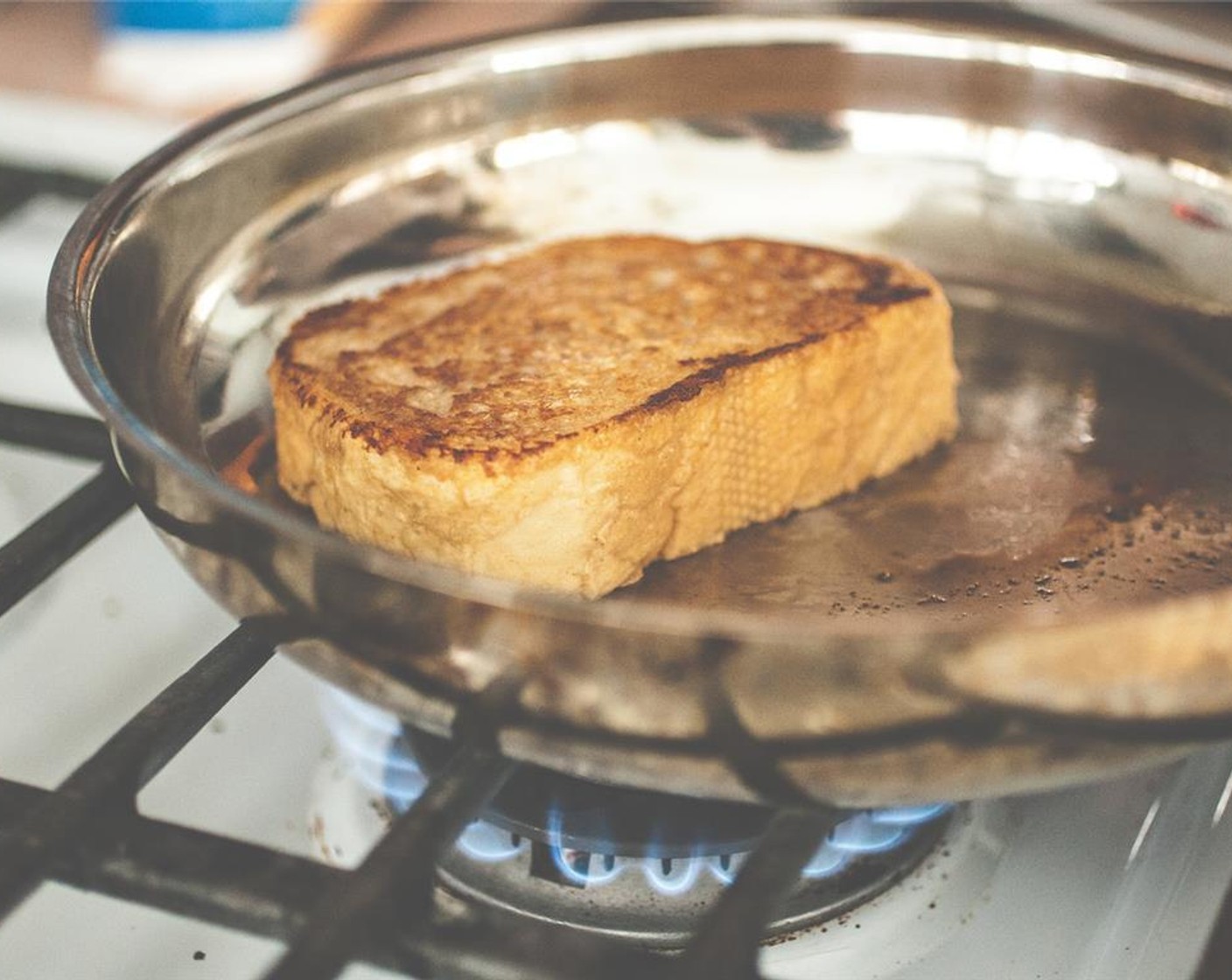 step 4 Place the slice in the hot pan for a few minutes on each side, flipping with a metal spatula. Repeat with remaining slices of bread, until all the liquid is gone.