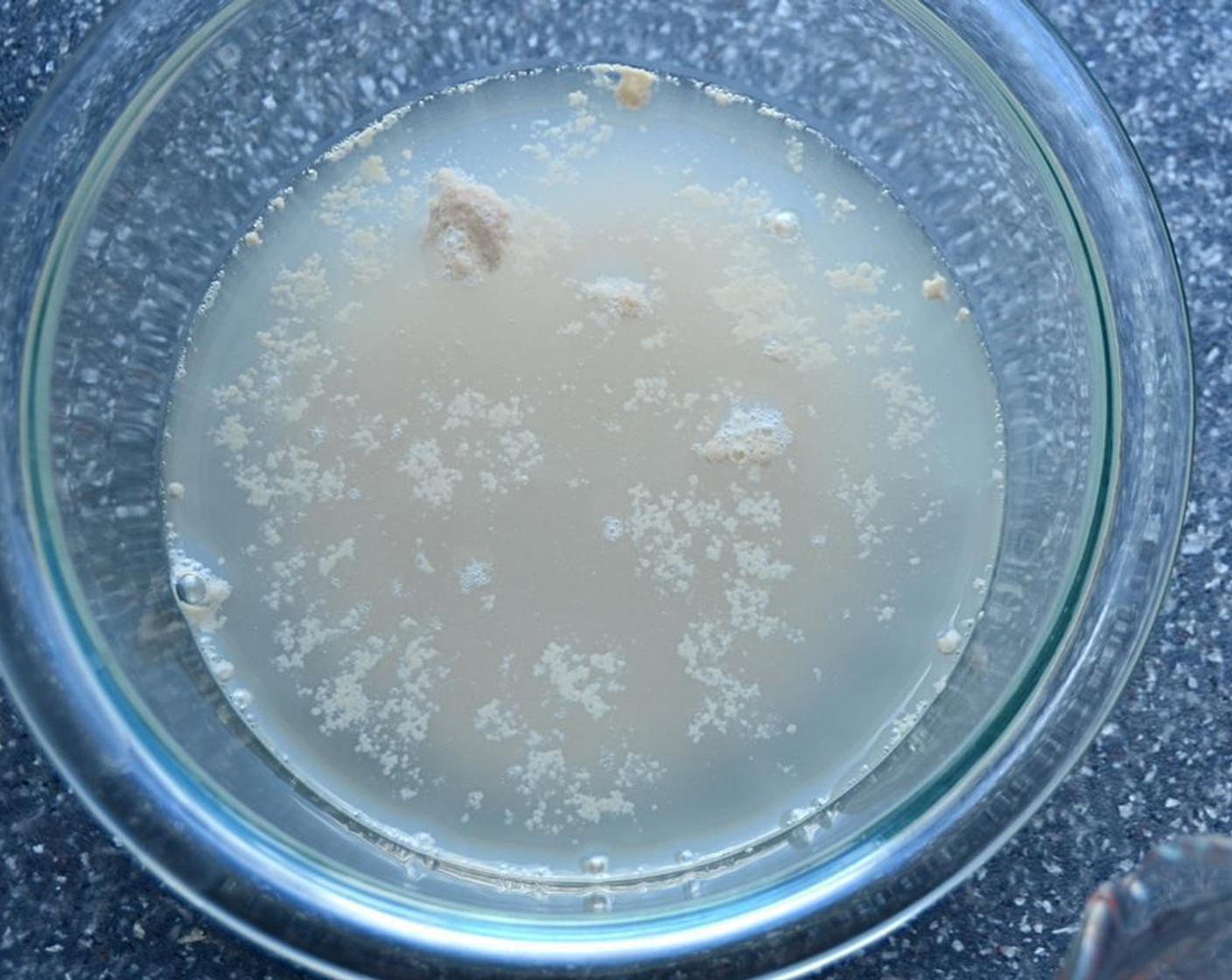 step 2 In a separate bowl, combine Active Dry Yeast (1/2 Tbsp) with the Water (1 cup) and stir together. Set aside for a few minutes until the yeast starts to bubble.