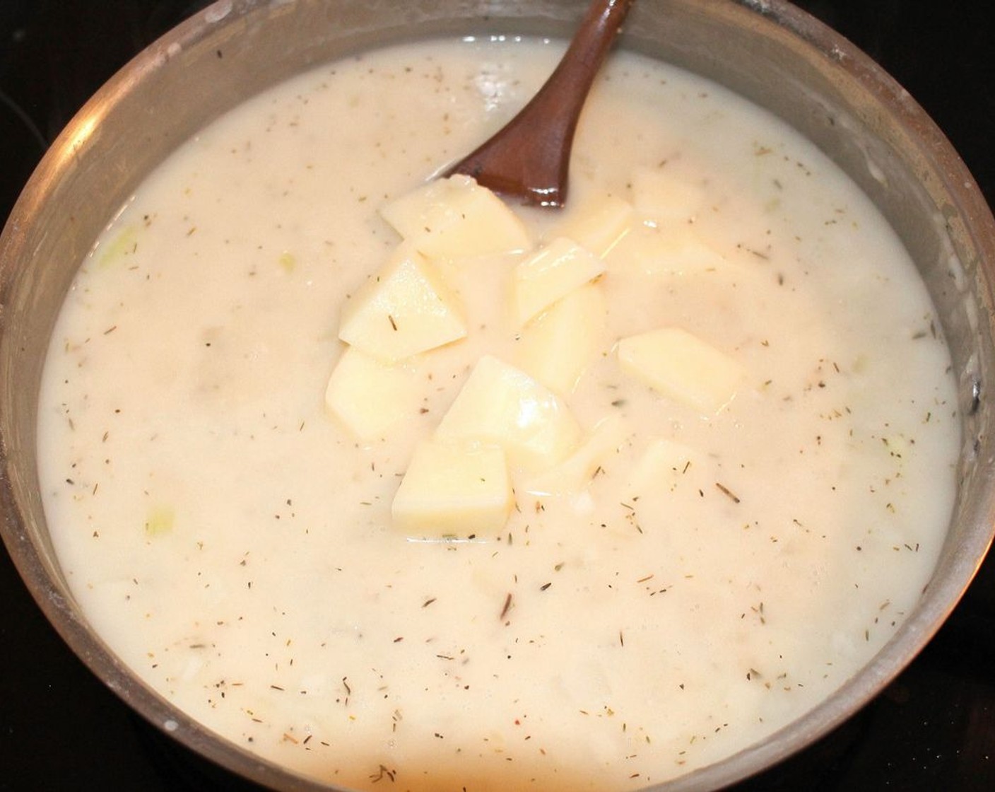 step 5 Add Potatoes (2). Simmer until potatoes are soft but not mushy.