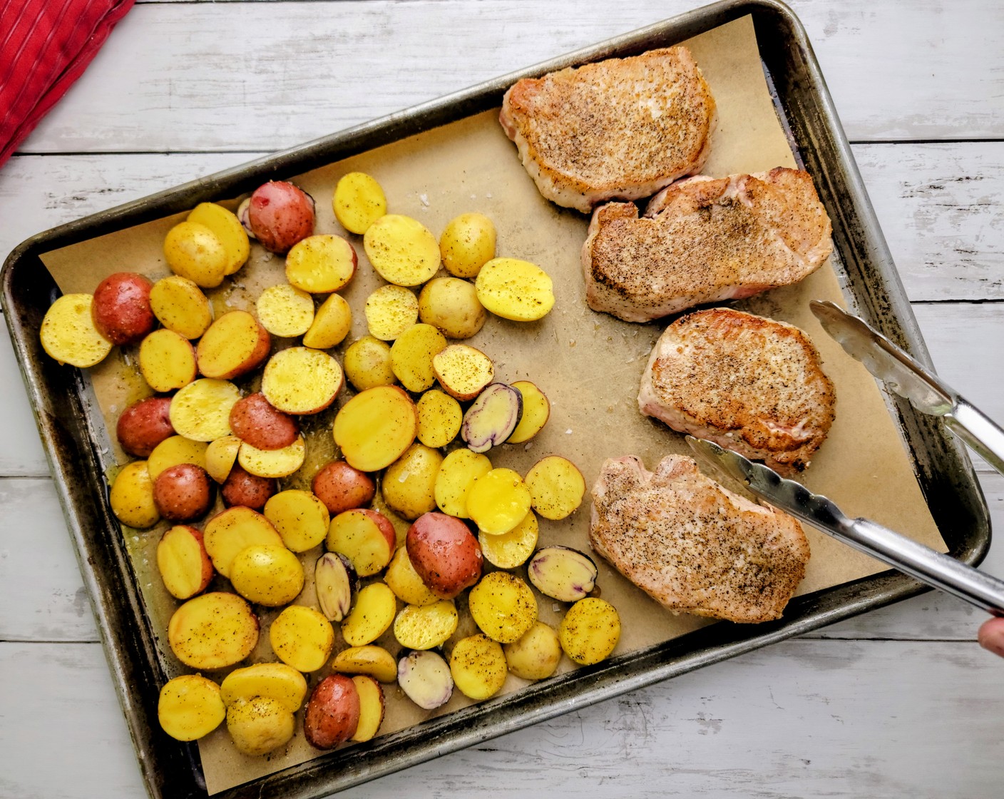 step 7 Place the chops on the other side of the sheet pan. Put the sheet pan in the oven and roast for 20 to 24 minutes.