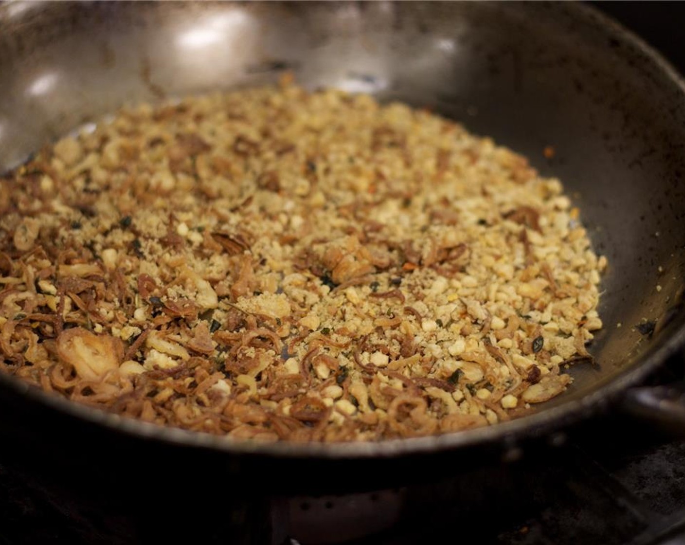 step 3 Combine Crushed Red Pepper Flakes (2 Tbsp), toasted garlic, fried shallots, and Brown Sugar (2 1/2 cups) in a mixing bowl and toss well. Place the chili sugar mixture into a room temperature heavy-bottomed pot or pan.