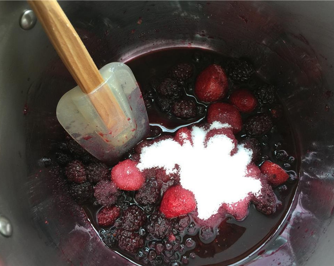 step 5 While the panna cotta is chilling, pour the Fresh Mixed Berries (2 2/3 cups) and Granulated Sugar (1/2 cup) into a medium saucepan and cook over medium heat.