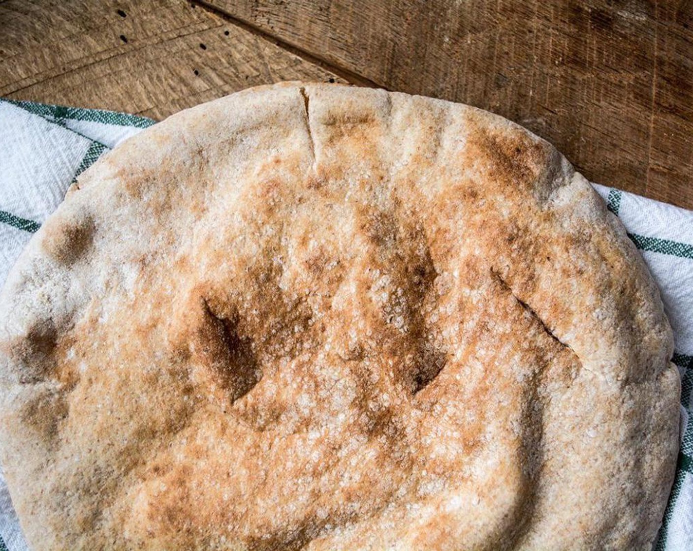 step 6 Meanwhile, put the Whole Wheat Pita Bread (2) on a pan and bake them in the oven for 7-10 minutes to make them crispy. If you want a soft crust, skip this step or only bake them for 5 mins.