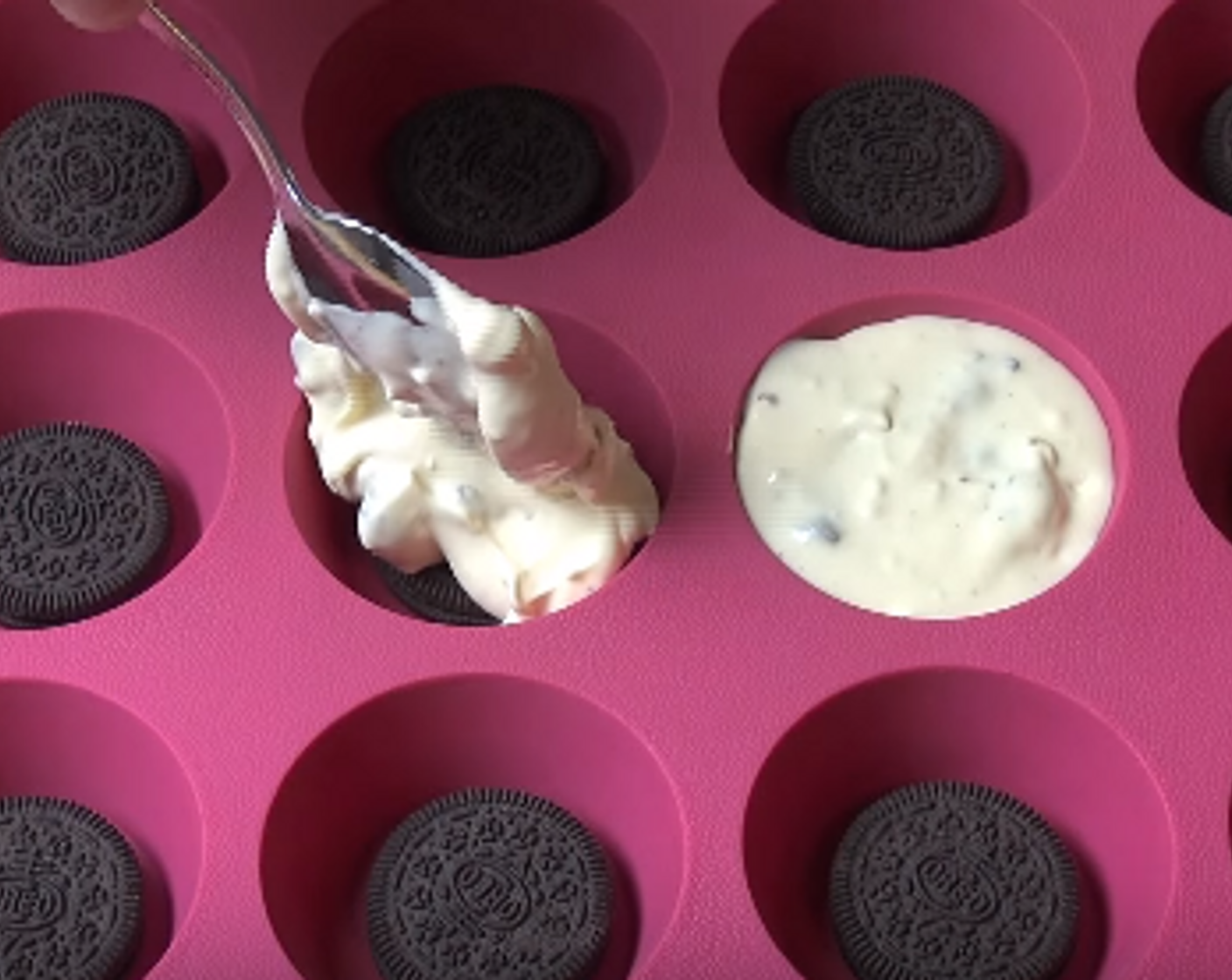step 4 In a muffin pan, place the remaining full Oreo Cookies in the base of each cup. Divide the cheesecake mixture between each cup.