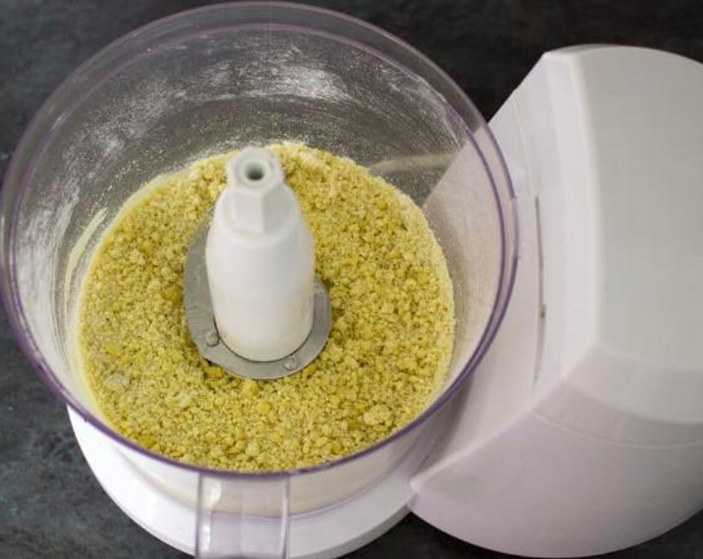 step 1 To make the crust, put the All-Purpose Flour (1 1/4 cups), Salt (1 tsp), and Olive Oil (4 Tbsp) in a food processor and blitz briefly until it’s all blended together.