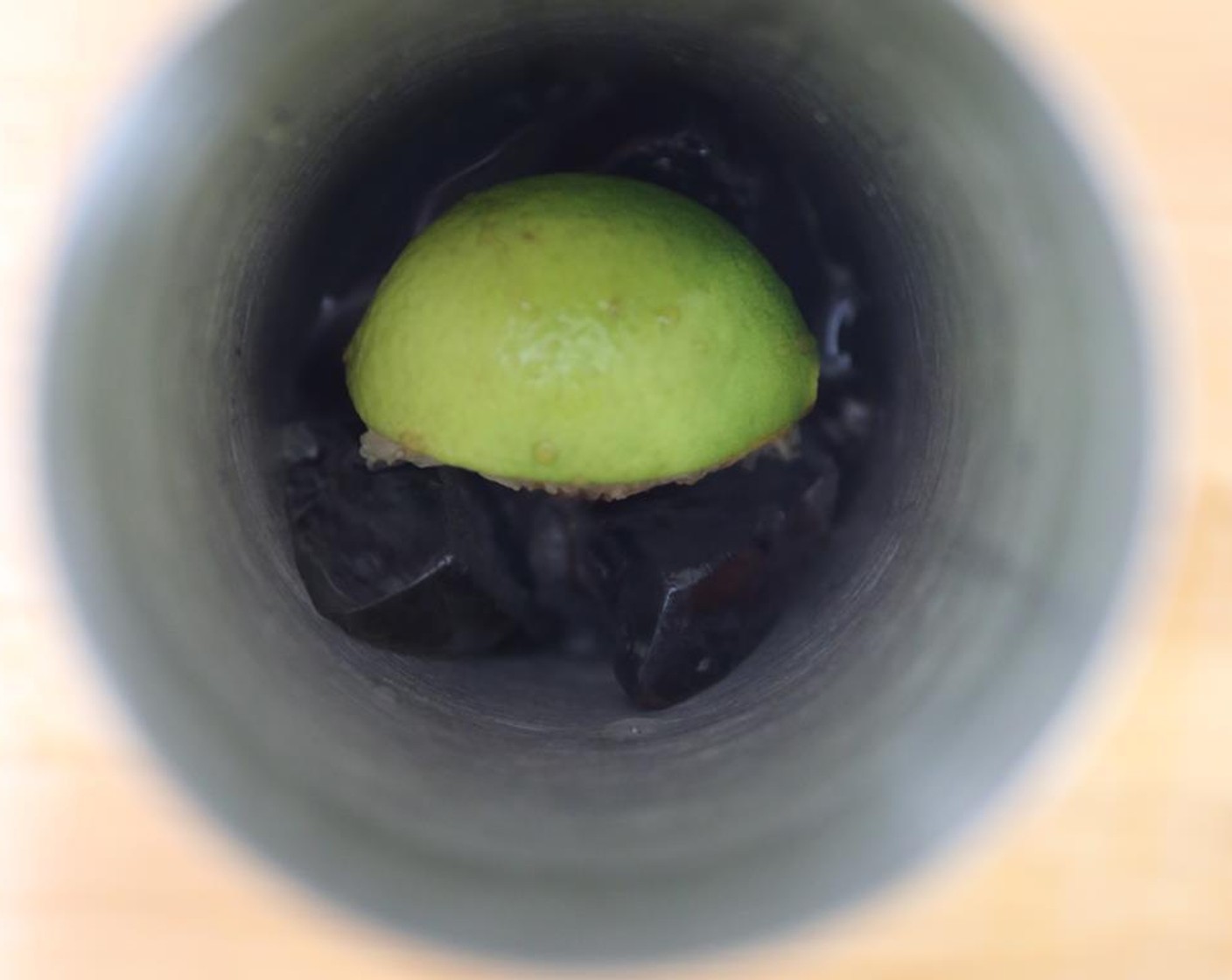 step 1 Quarter the Lime (1). Juice a wedge into a shaker with Ice (to taste).
