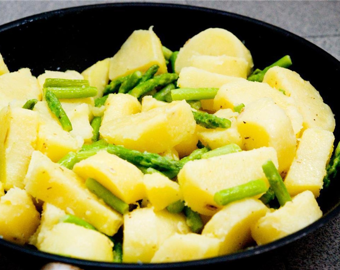 step 2 Heat the Unsalted Butter (1 Tbsp) in a large pan over medium heat, and add the potatoes and asparagus. Cook for 10 minutes.