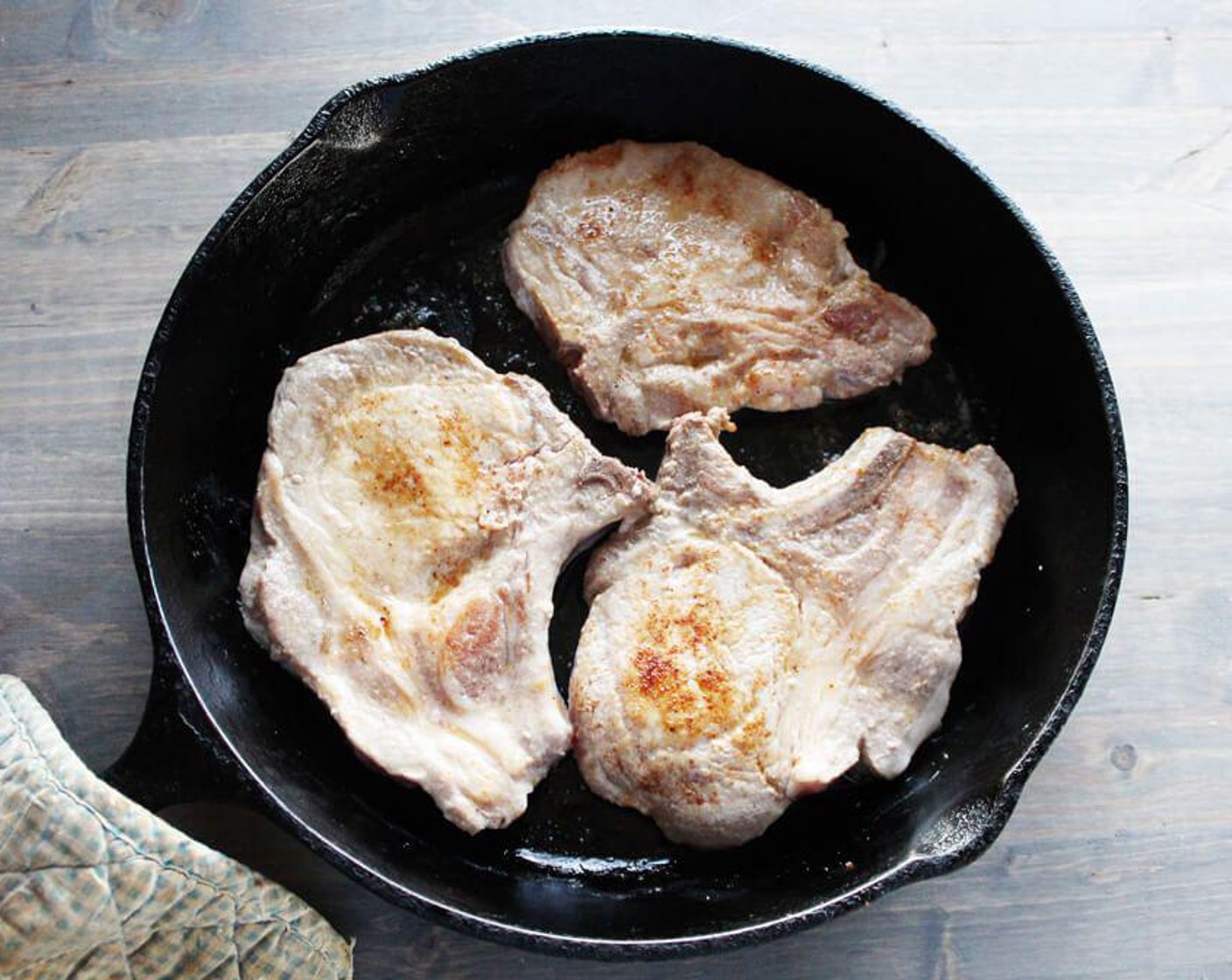 step 2 Sprinkle the Pork Chops (6) on both sides with the All-Purpose Seasoning (1 Tbsp). In a large skillet, melt Butter (1 Tbsp) over medium-high heat.