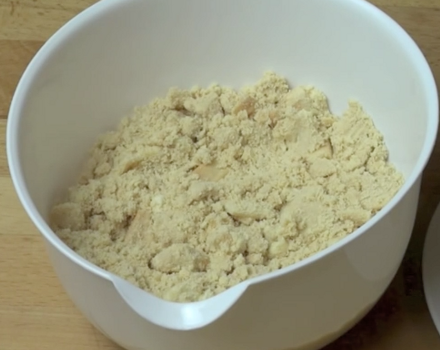 step 1 Into a bowl, add in and mix your crushed Vanilla Cream-Filled Cookies (20), and Butter (3 Tbsp).
