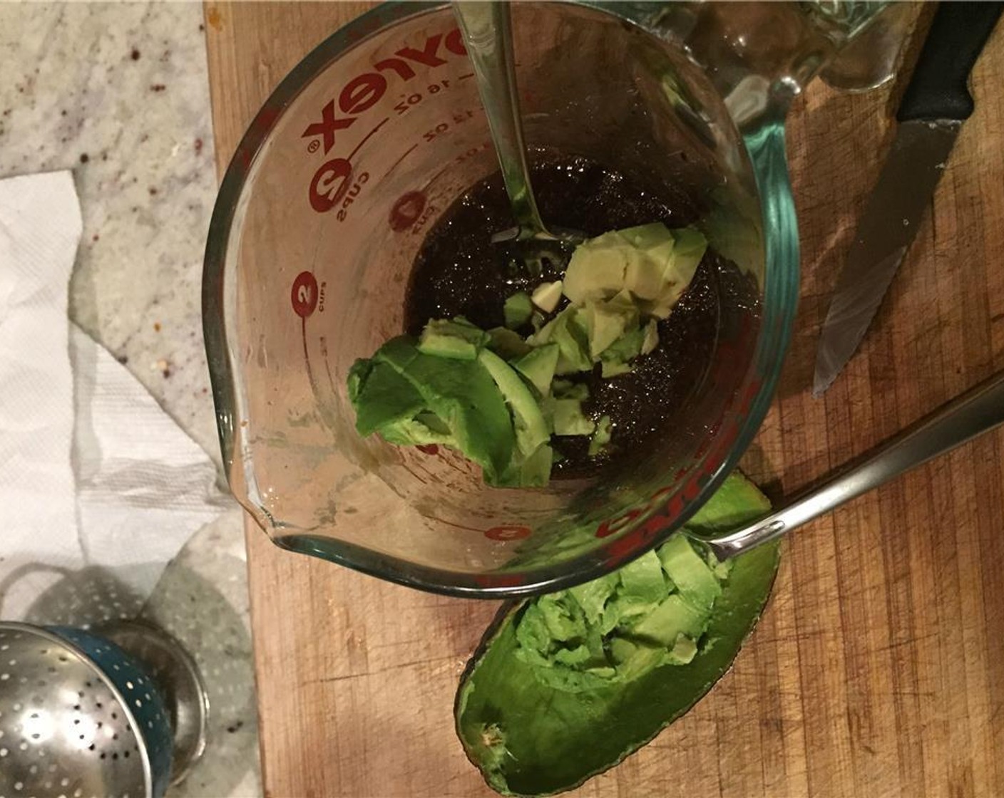 step 2 Dice Avocado (1/2) and mix in well. Crush most of the avocado against the side of the bowl.