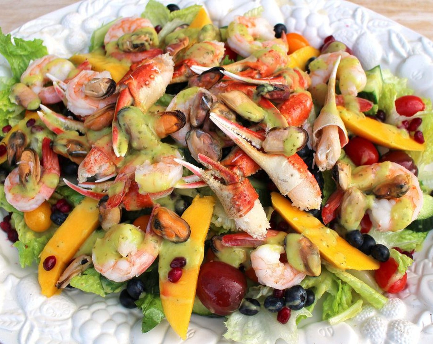 step 9 Top with Fresh Mixed Berries (to taste) and seafood, drizzle generously with Vinaigrette (to taste). Serve and enjoy!
