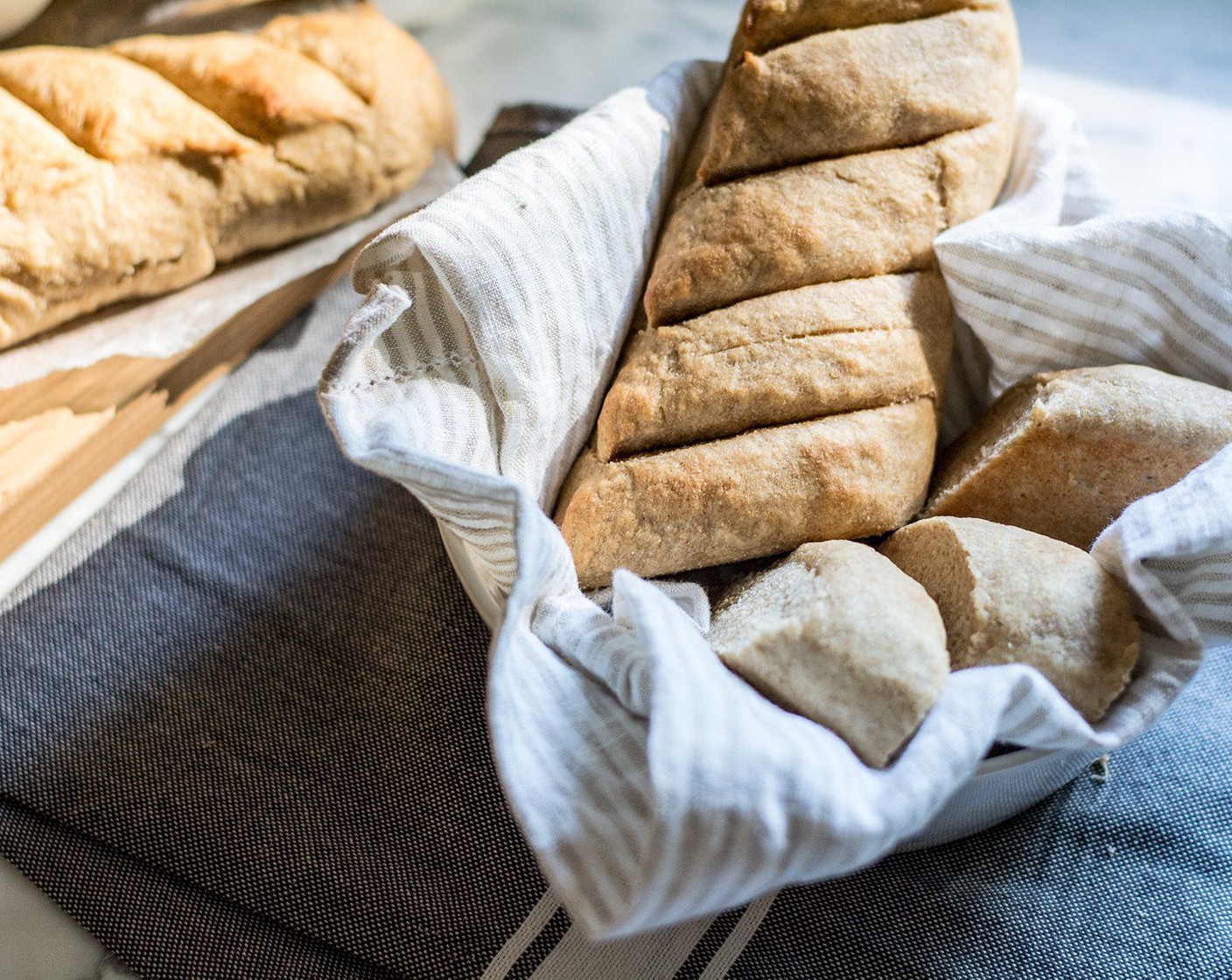 step 7 Add water to baking sheet and place on bottom rack in oven, then bake baguette loaves for 15 minutes. For that golden/crispy outer edge, brush each baguette with melted butter halfway through baking process. Serve and enjoy!