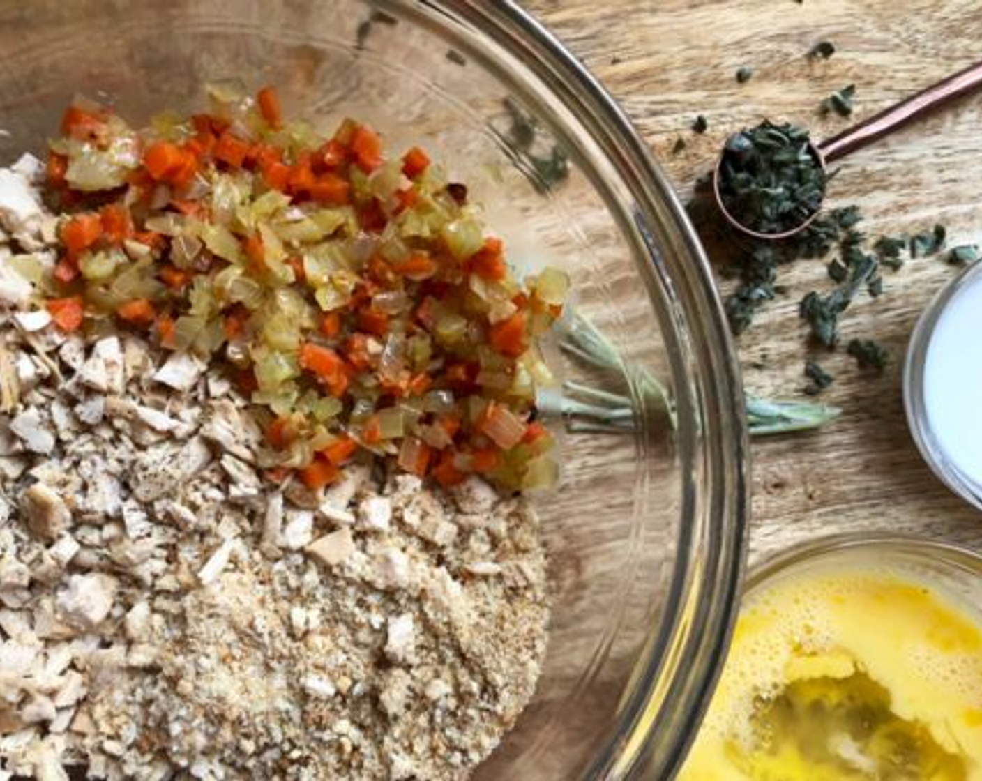 step 9 To prepare croquettes, combine reserved vegetables, Rotisserie Chicken (2 cups), Breadcrumbs (4 Tbsp), Milk (2 Tbsp), Fresh Sage (1 tsp), Salt (1/2 tsp), Finely Ground Black Pepper (1 dash), Farmhouse Eggs® Large Brown Egg (1), and Eggland's Best Classic Egg (1) white. Cover and refrigerate 30 minutes or until firm.