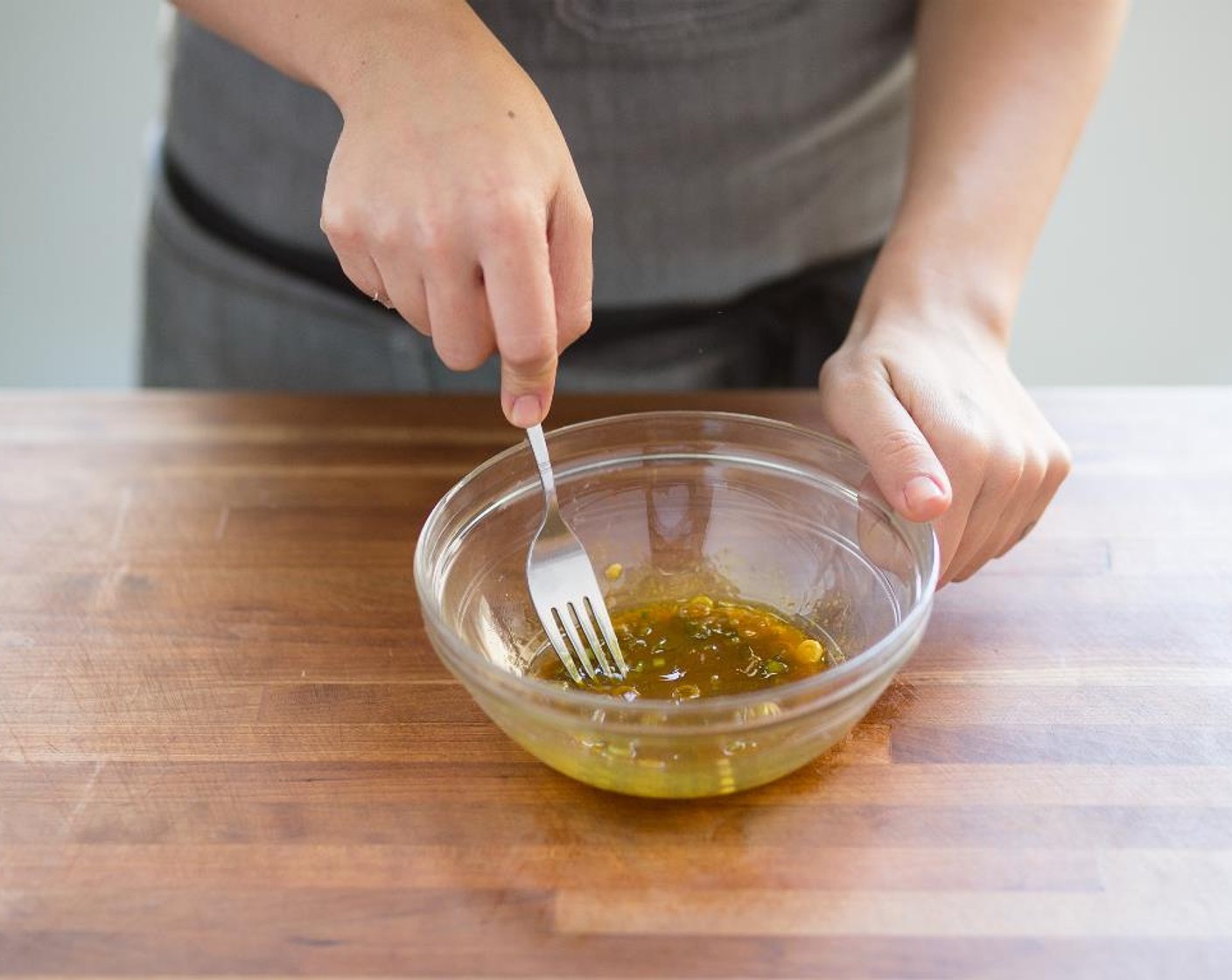 step 8 Mince the light ends and place in a small bowl. Add the Ground Turmeric (1/4 tsp), Fish Sauce (2 Tbsp), and Sesame Oil (2 tsp). Stir to combine; hold.