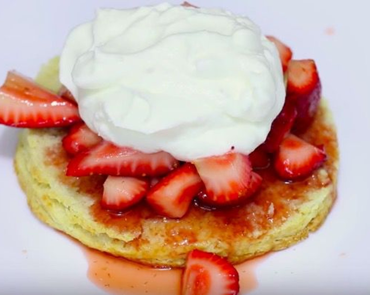 step 7 Take out the shortcake and cut into half, put strawberries in the center. Served with whipped cream and enjoy!