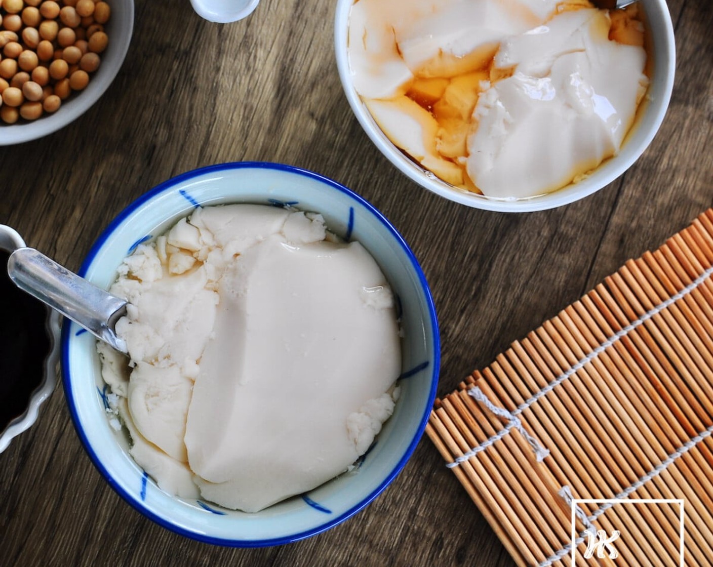step 15 To serve, use the sharp and flat ladle to gently scoop thin slices of soft and velvety beancurd into bowls. Then top with ginger sugar syrup or palm sugar syrup before serving.