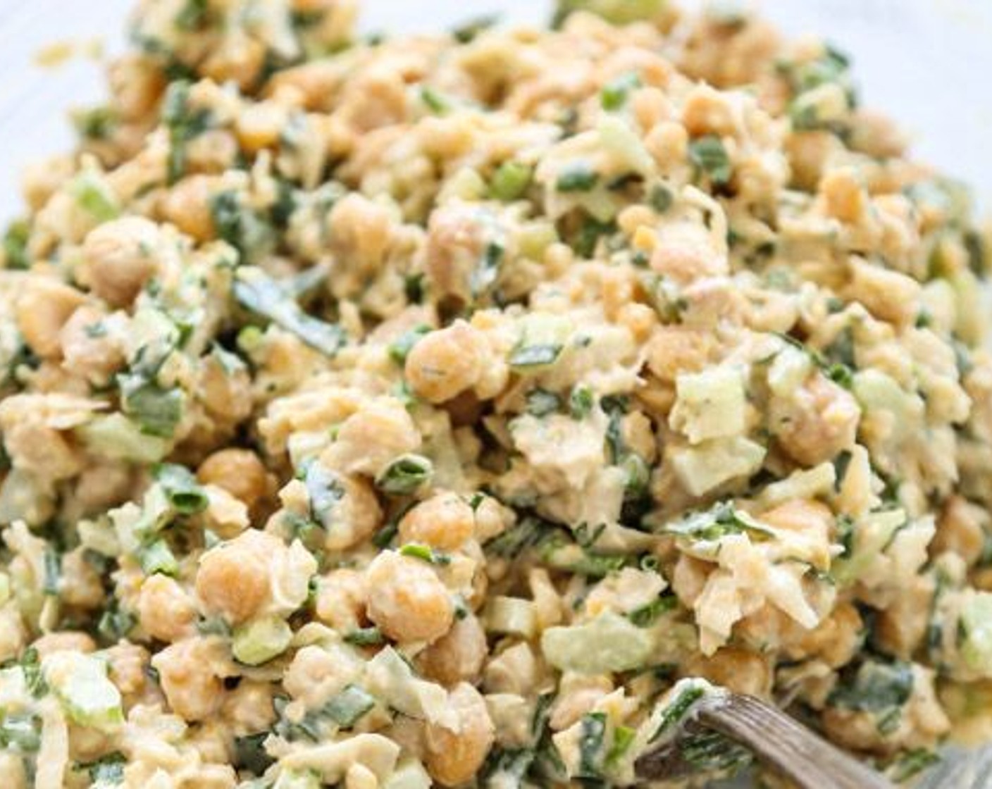 step 2 Add the Celery (2 stalks), Scallion (1/4 cup), Mayonnaise (1/4 cup), and 3 Tbsp of Lemon (1) to the chickpeas and mix well. Season generously with Sea Salt (to taste) and Ground Black Pepper (to taste). Stir in the Fresh Chives (1/4 cup) and the Fresh Parsley (1/2 cup).