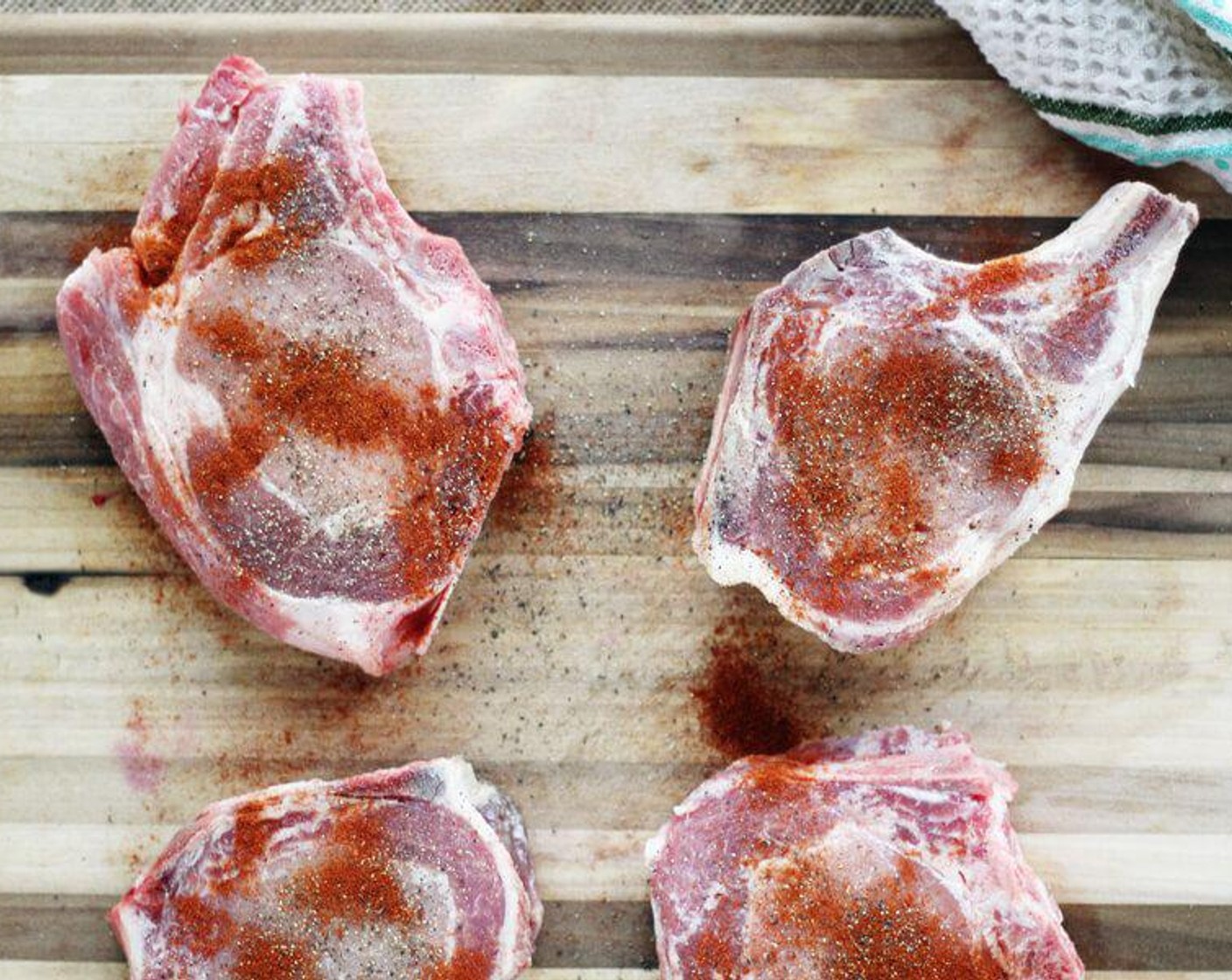 step 4 While the pepper jelly sauce is simmering, heat the Vegetable Oil (2 Tbsp) in a 12-inch cast iron skillet over medium-high heat. Sprinkle both sides of the Bone-In Pork Chops (4) with Paprika (to taste), Salt (to taste), and Ground Black Pepper (to taste).