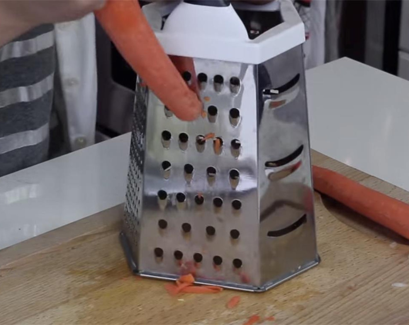 step 7 Peel and wash the Carrots (2). Grate the carrots using a box grater with its largest holes.