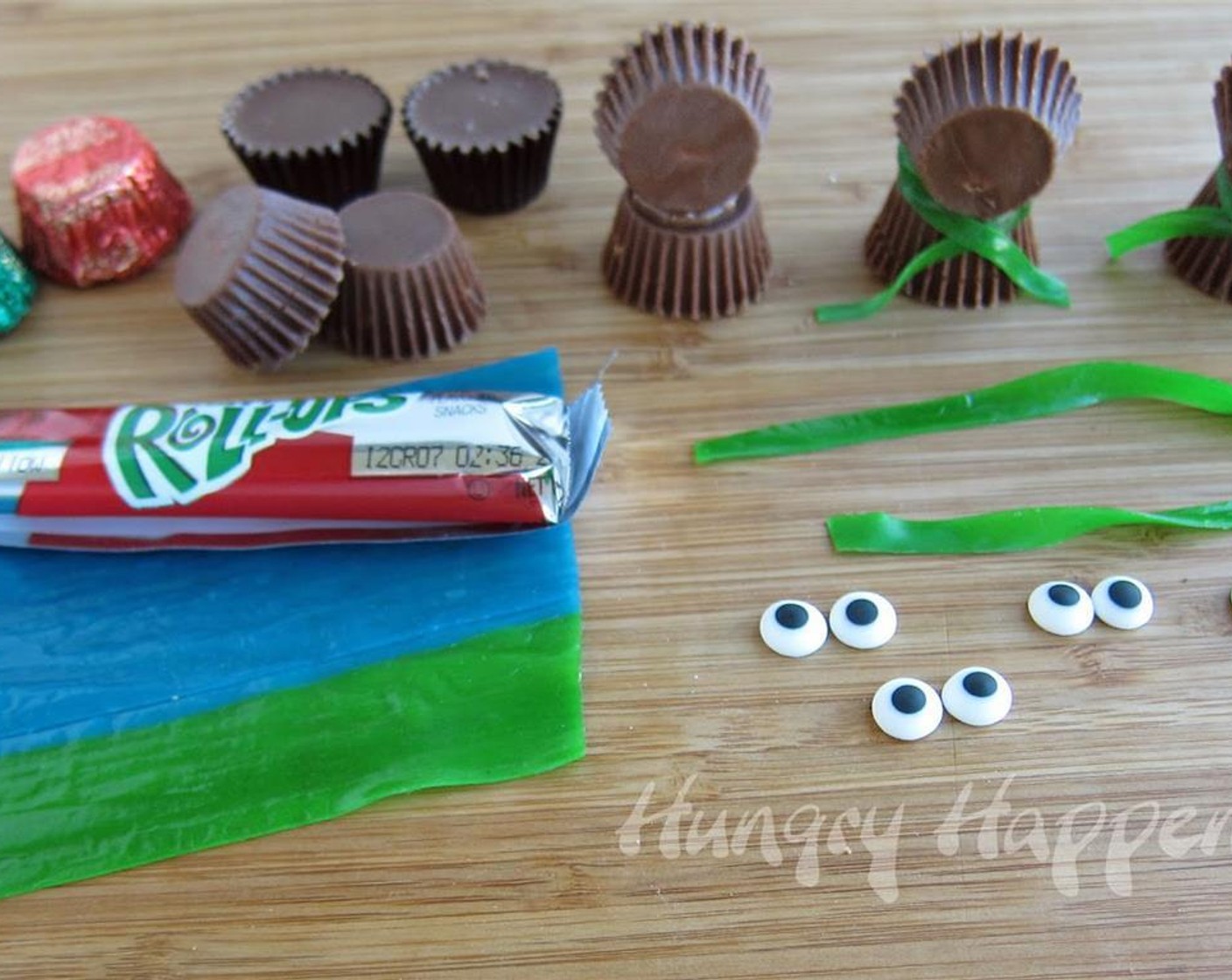 step 1 Unwrap Miniature Reese`s Cup (24) removing the foil and the paper cup. Open the bag of M&M's® Milk Chocolate Candy (1 pckg) and set aside the red-colored M&M's. Set aside 2 green-colored Fruit Roll-Ups (2).