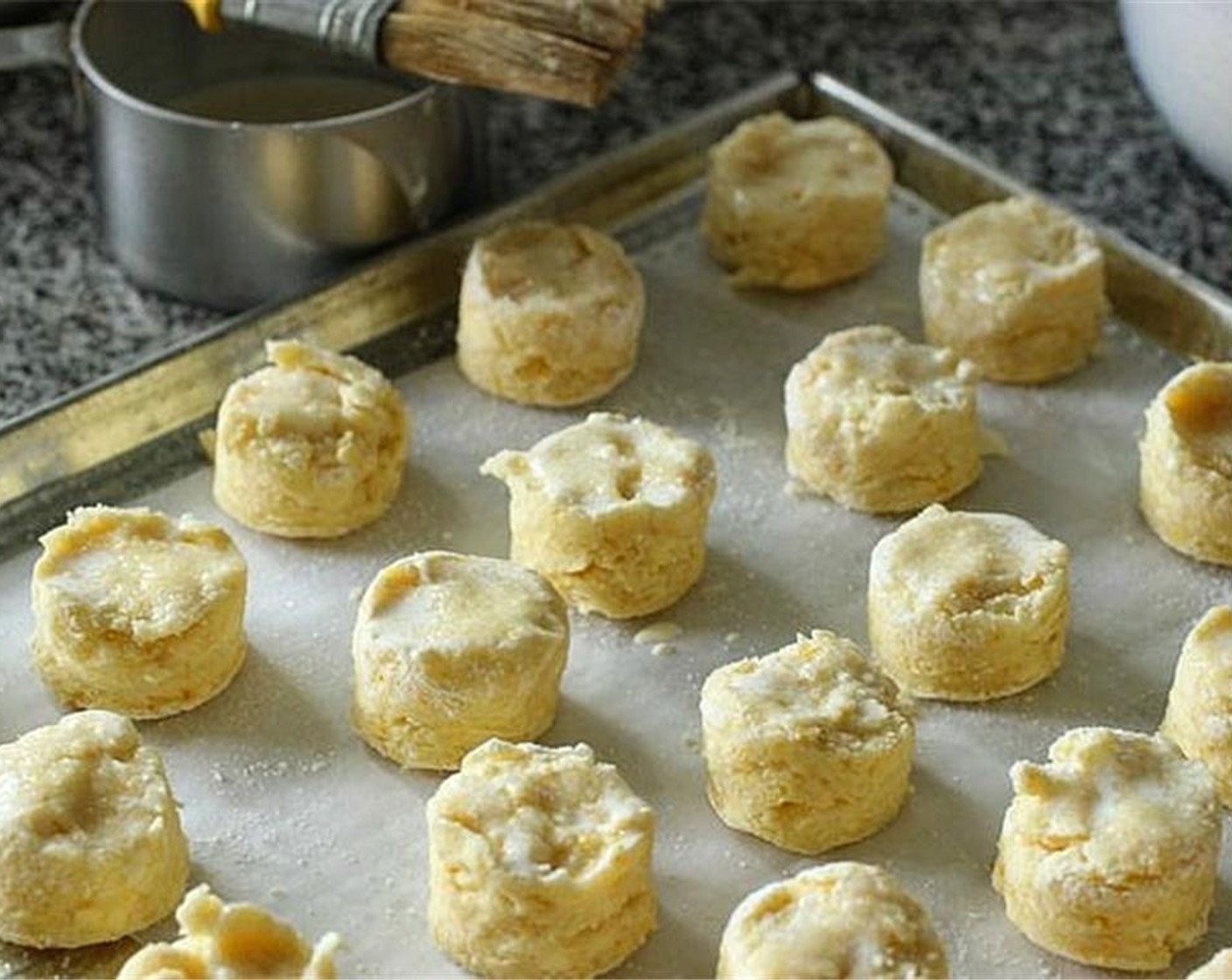 step 6 Brush tops with additional heavy cream and sprinkle with sugar. Bake for about 20 minutes until tops are golden and risen.