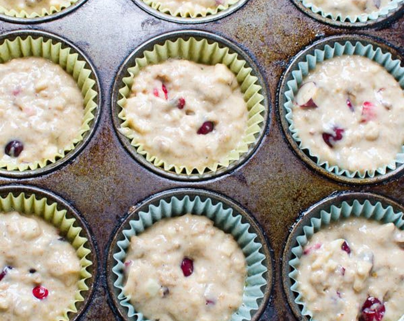 step 8 Spoon evenly into muffin tins and bake.  For regular sized muffins - bake 20-25 minutes.  For mini muffins, bake 12-15 minutes or until a cake tester comes out clean.