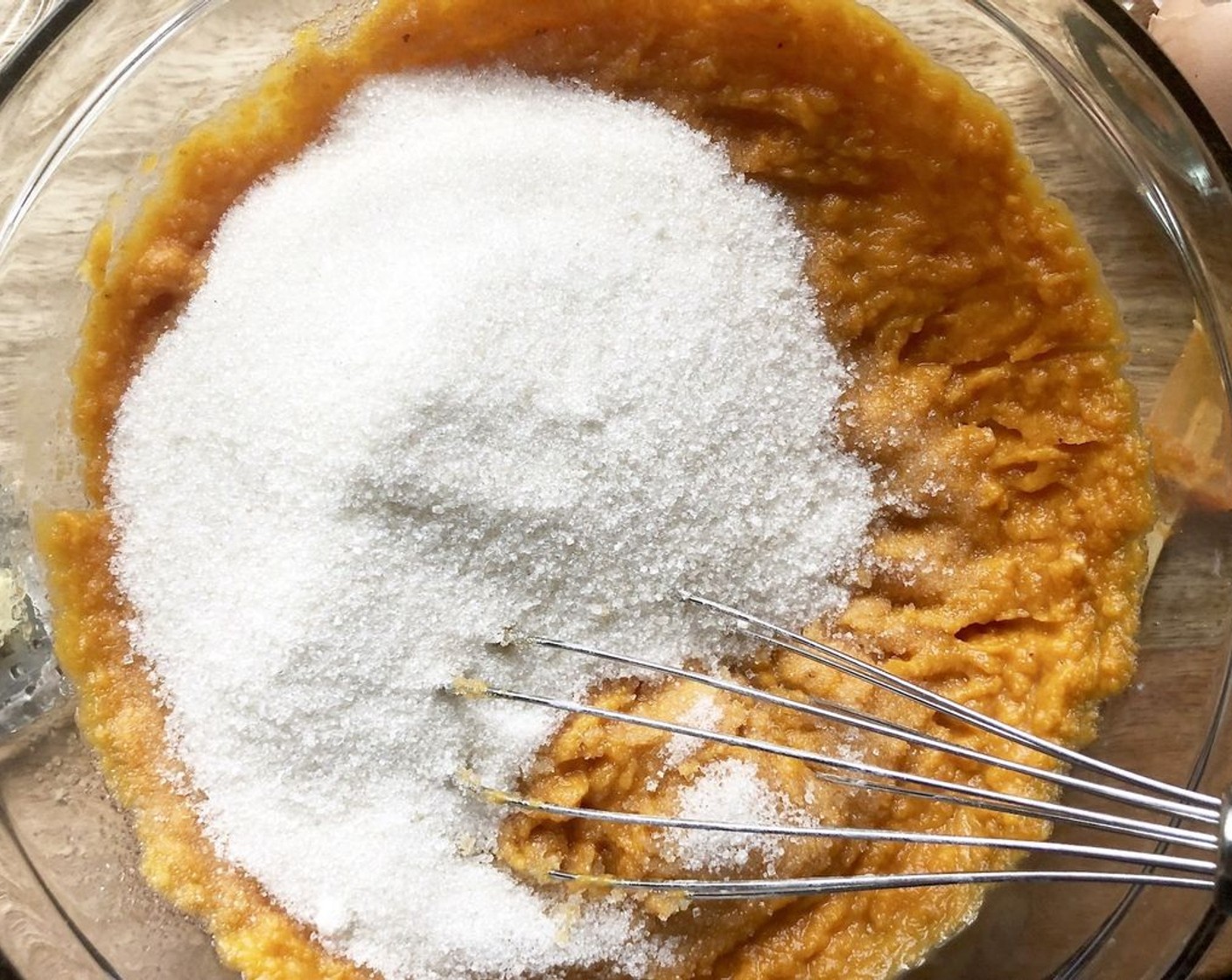 step 4 In a separate large bowl, whisk the 100% Pumpkin Purée (1 can), Granulated Sugar (1 1/2 cups), Eggs (2), and Fresh Ginger (1 1/2 Tbsp) until combined. Stream in the Extra-Virgin Olive Oil (1 cup), whisking constantly until mixture is homogeneous.