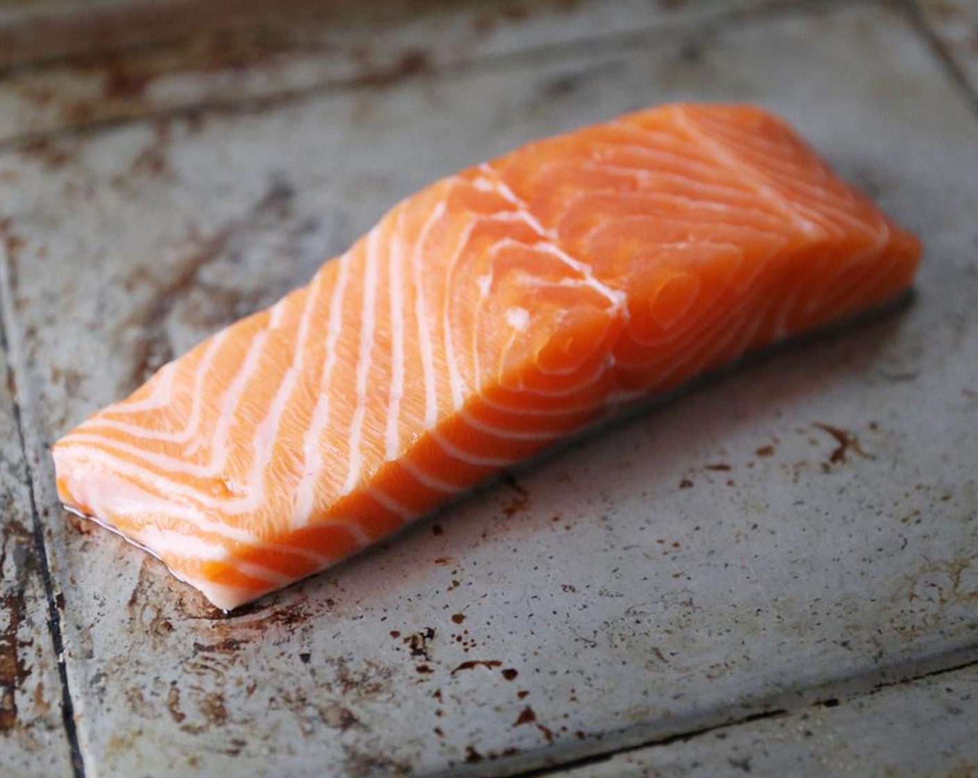 step 1 Place the Skin-On Salmon Fillets (2) skin-side down on an oiled cookie sheet.