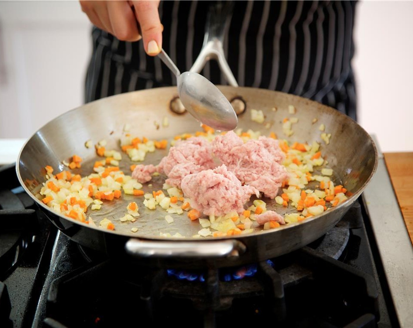 step 7 Add the Ground Veal (1 lb) to the pan, season with Salt (1/4 tsp) and stir to break up the meat. Cook for ten minutes.