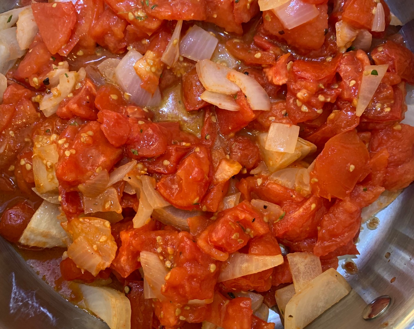 step 3 Once cool enough to handle, peel off the skins and transfer tomatoes and onions, and all the juices into a large pot.