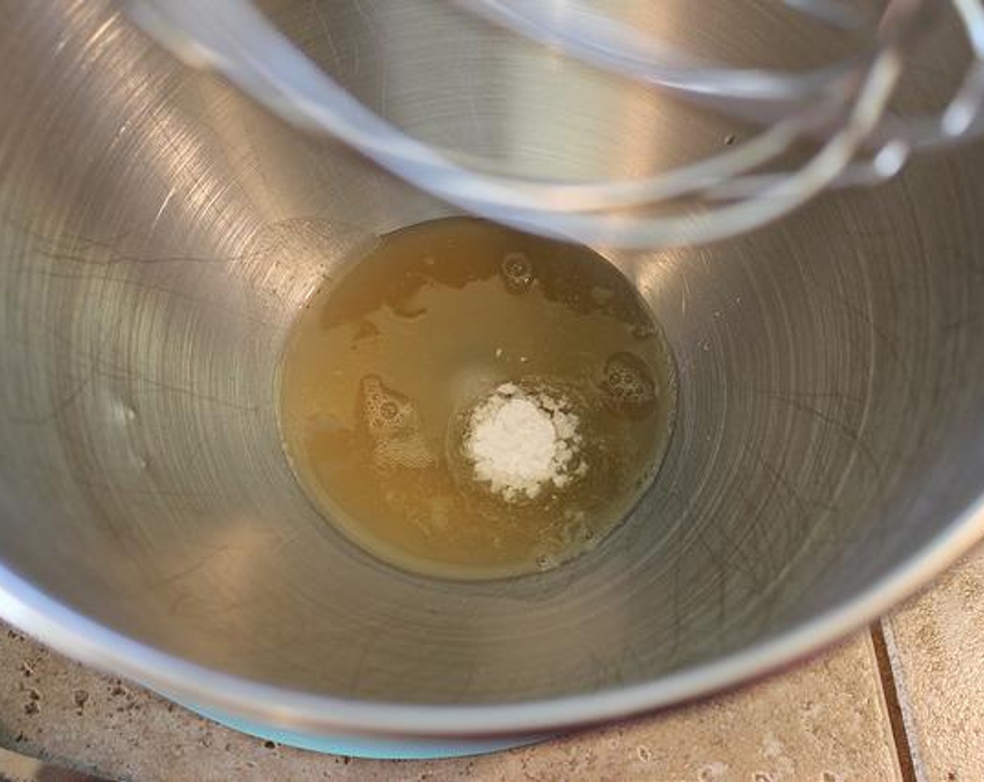 step 2 While Yeast is proofing, pour the Aquafaba (1/4 cup) along with the Cream of Tartar (1/2 tsp) into the clean & dry bowl of your stand mixer fitted with the whisk attachment.