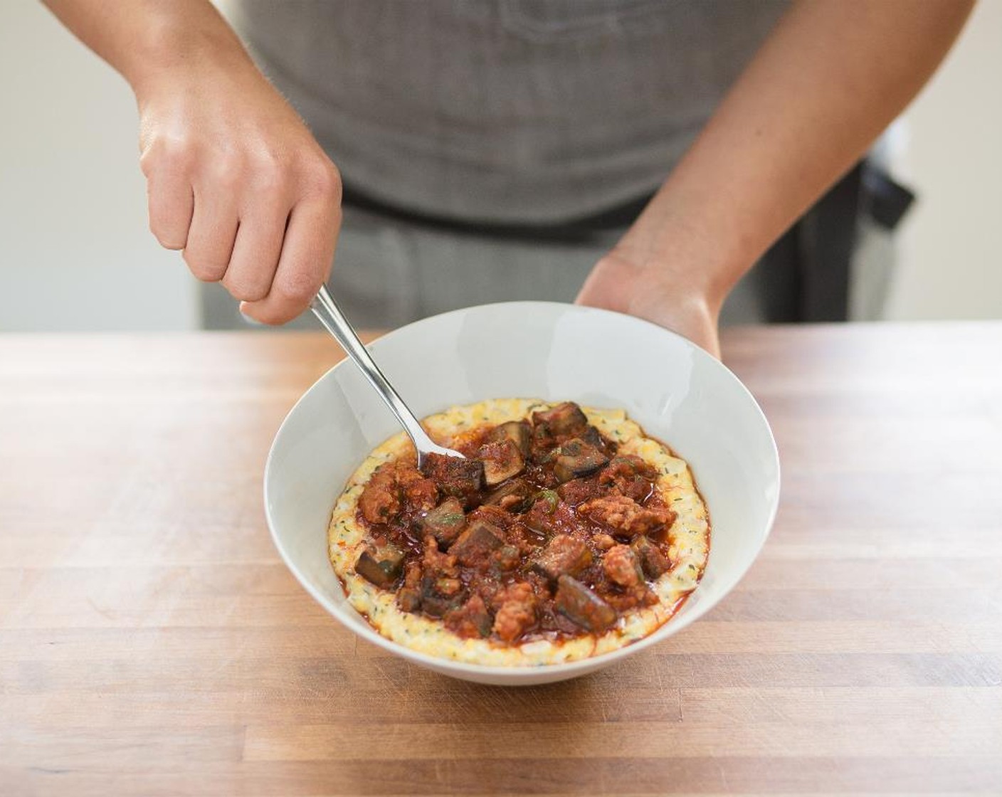 step 16 Spoon the polenta into the center of two plates. Top with turkey sausage mixture. Serve and enjoy!
