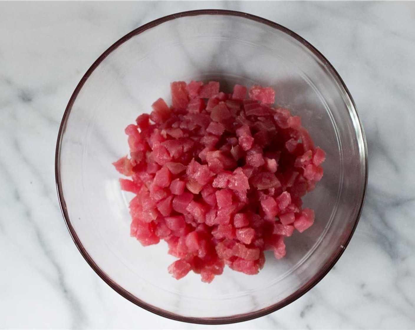 step 1 Cut the Sushi-Grade Tuna Fillet (1 lb) into a 1/4-inch dice and add to a large bowl.