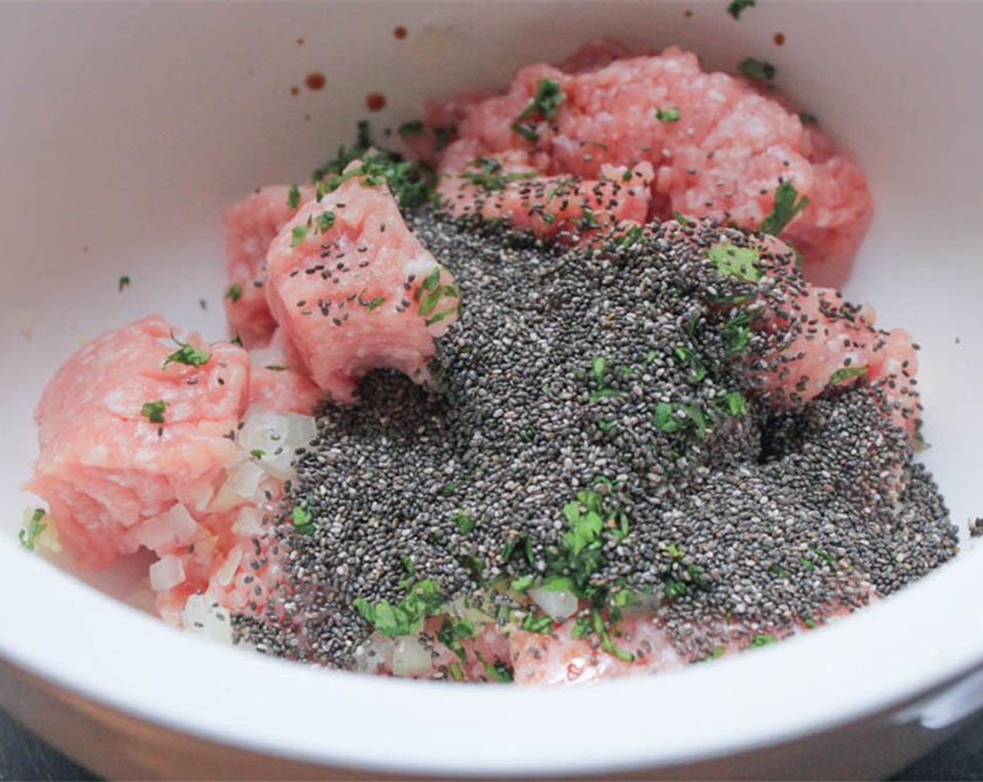 step 2 Place the Ground Pork (1 lb), Fresh Ginger (1/2 Tbsp), Garlic (3 cloves), Fresh Cilantro (1/4 cup), Yellow Onion (1/3 cup), Low-Sodium Tamari Sauce (1 1/2 Tbsp), and Chia Seeds (2 Tbsp) in a large bowl. Using your hands, mix all of the ingredients until well combined.